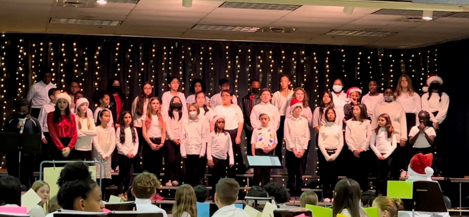 ms wildermuth and the chorus on stage