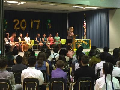 photo of students listening to promotion ceremony