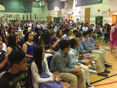 photo of students listening to promotion ceremony