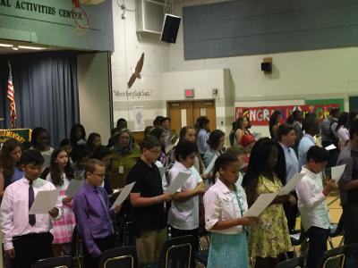 photo of students listening to promotion ceremony