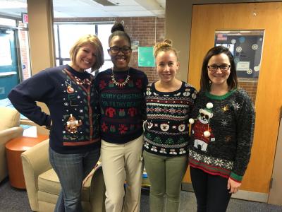 photo of four teachers in ugly sweaters